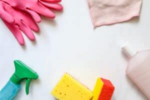 Assortment of cleaning materials, cloths, gloves and products